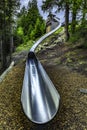Metal slide in the alpine forest