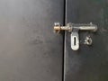 Metal sliding padlock Handle Fitted On metal cupboard door bolt Royalty Free Stock Photo