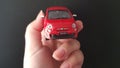 Metal small Fiat 500 model in female hand