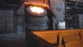 Metal smelting in steel mill furnace. Footage. Top view on pot of solidified metal next to sprinkles and sparks of hot Royalty Free Stock Photo