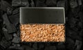 Metal smoker box with wood chips on charcoal Royalty Free Stock Photo