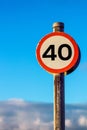 Metal speed limit sign with the number 40 displayed at the center of the sign