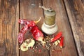 Metal spice grinder with red hot peppers and bay leaf Royalty Free Stock Photo