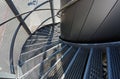 Metal spiral staircase near a modern building