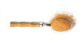 Metal spoon with granulated brown sugar on white background