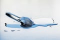 Metal spoon on a large water drop on a clean surface Royalty Free Stock Photo