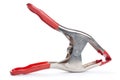 Metal spring clamp with red plastic on handles and tip Royalty Free Stock Photo