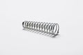 Metal spring on white background.Copy space