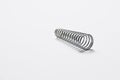 Metal spring on white background.Copy space