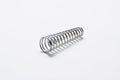 Metal spring  on white background.Copy space Royalty Free Stock Photo