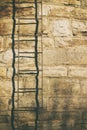 Metal stair on stone wall Royalty Free Stock Photo