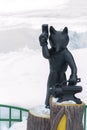 Metal statue of fox with hammer that forges on anvil. Surgut, Russia - February 20, 2020