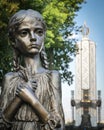 Metal statue of a girl form Holodomor monument memorial in Kiev, Ukraine