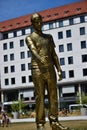 Metal statue to the common caritative helper in MARIENHOF square in Munich, Germany