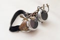 Metal steampunk glasses, google on white background, close up Royalty Free Stock Photo