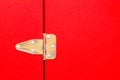 Metal steel hinge on red door Royalty Free Stock Photo