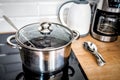 Metal steel pot in the kitchen with induction stove Royalty Free Stock Photo