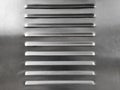 Metal / steel surface with slits for venting. Royalty Free Stock Photo