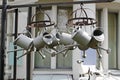 Metal steel watering cans hanging on the dryer