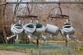 Metal steel watering cans hanging on the dryer