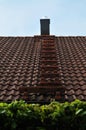 Metal ladder for chimney sweeper on a roof Royalty Free Stock Photo