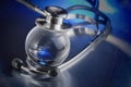 Metal stethoscope on globe Royalty Free Stock Photo