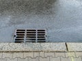 Metal storm drain in street