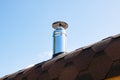 Metal stove pipe on the roof closeup Royalty Free Stock Photo