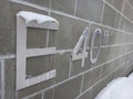 Metal street number plaques on a brick wall Royalty Free Stock Photo