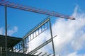 Metal structure building construction site crane lifting Royalty Free Stock Photo