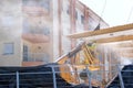 Male worker, sandblasting metal structure.