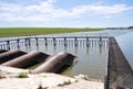 Metal structure of dam, pipes and metal net platform at water storage