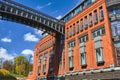 Metal structure of footbridge and Red brick wall in an old brewery Royalty Free Stock Photo