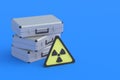 Metal suitcases near radiation sign. Nuclear briefcase