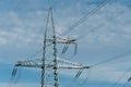 Metal supports of power lines. Poles for holding wires transmitting electricity from the generator to the consumer Royalty Free Stock Photo