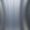 Metal surface exhibiting a brushed texture with subtle vertical Royalty Free Stock Photo