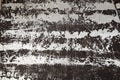 The metal surface is painted black, erased by stripes to a metallic silver sheen, with traces of scratches cracks and stripes. Royalty Free Stock Photo