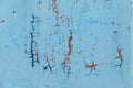 The metal surface is painted in a sky-blue color, old cracked texture paint. Abstract grunge background Royalty Free Stock Photo