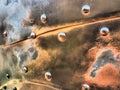 Metal surface with rivets and bolts. Abstract background of a military or industrial nature. Sheathing with dents, seams and nuts Royalty Free Stock Photo