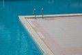 Metal swimming pool ladder in detail corner Royalty Free Stock Photo