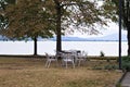 Metal table and chairs in a public park on Lake Trasimeno Umbria, Italy Royalty Free Stock Photo