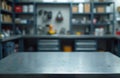 Metal table surface in focus with blurred workshop background. Storage racks with boxes, tools, instruments at service station. Royalty Free Stock Photo