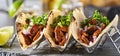 Metal taco holder with three mexican carne asada street-tacos Royalty Free Stock Photo