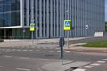 Metal terminals for bicycle parking, intersection and cycle track near a modern no name city office building Royalty Free Stock Photo