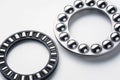 Metal Thrust Ball and Roller bearing isolated on white background. Spare part for heavy and automotive industry. Machinery concept