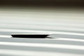 Metal tip for the ink pen on a white background in solar rays. stationery on white desk close up side view. spelling lessons and Royalty Free Stock Photo