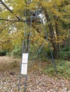 Metal tower with chair and warning under police surveillance sign Royalty Free Stock Photo