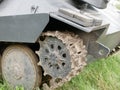 Metal tracks on a tank from the Second World War. Rubberized wheels of ancient armored vehicles. A tank painted in Royalty Free Stock Photo