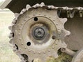 Metal tracks on a tank from the Second World War. Rubberized wheels of ancient armored vehicles. A tank painted in Royalty Free Stock Photo