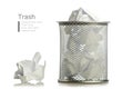 Metal trash bin from crumpled pape